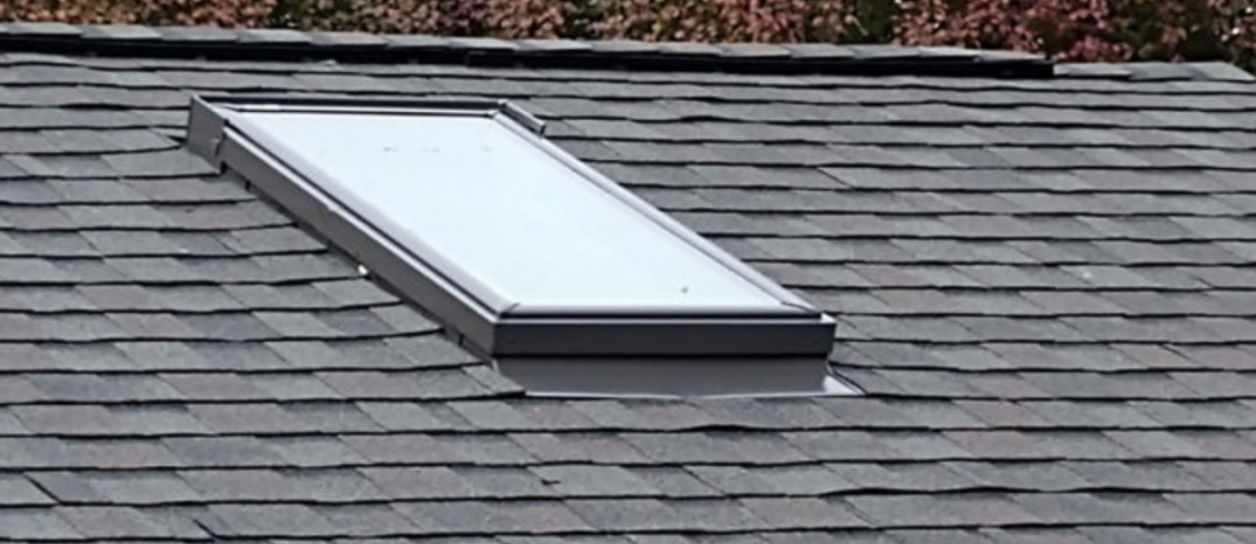 Skylight on a Moire Black roof | Summit Roofing